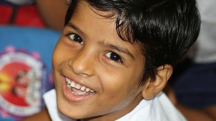 Smiling child showing their teeth