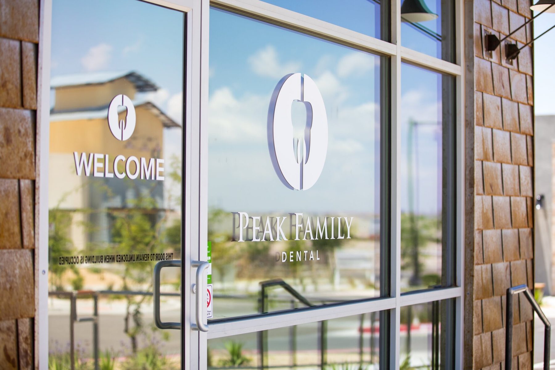 Glass entrance doors at Peak Family Dental