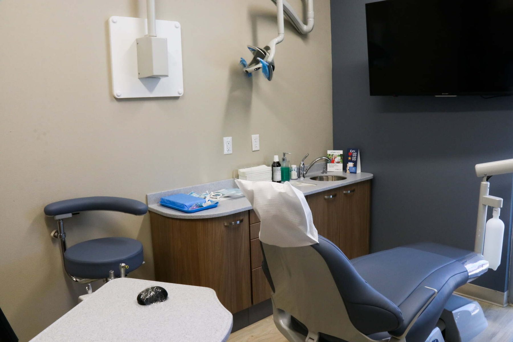Treatment room and wall-mounted imaging equipment at Peak Family Dental