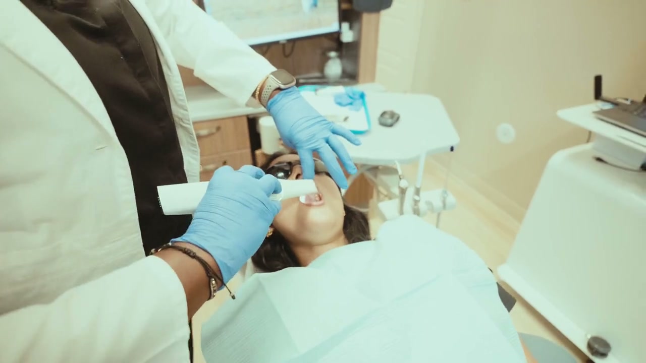 An intraoral scanner being used during a patient visit at Peak Family Dental